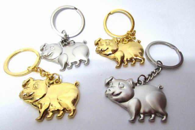 Schlüsselanhänger Schwein in silber und gold